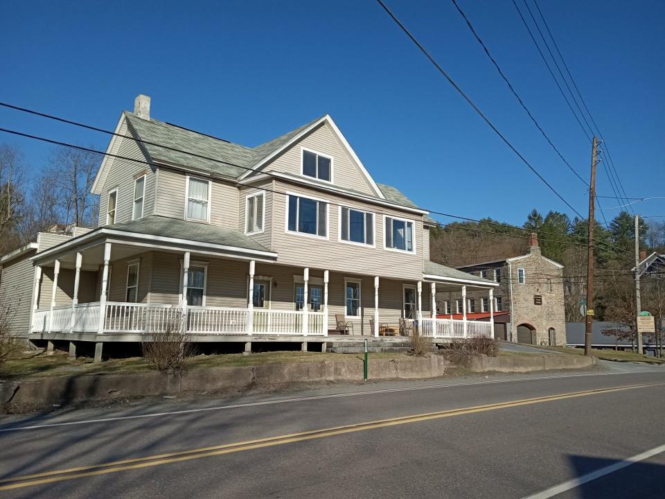 The White Mills Hotel, long vacant, is proposed to be rehabilitated for affordable workforce housing for Settlers Hospitality. The historic boarding house is seen along Main Street (Route 6) at the corner with Elizabeth Street. At right is the Dorflinger Factory Museum.