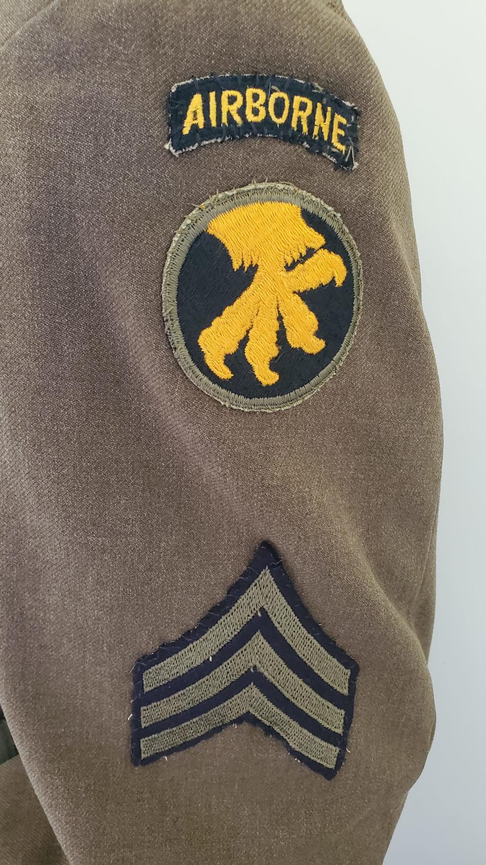 An airborne tab over the 17th Airborne Division "Golden Talons" patch and sergeant stripes on Sgt. Charles J. Schoepf's uniform, which is display at the Historical Society of Olde Northfield.