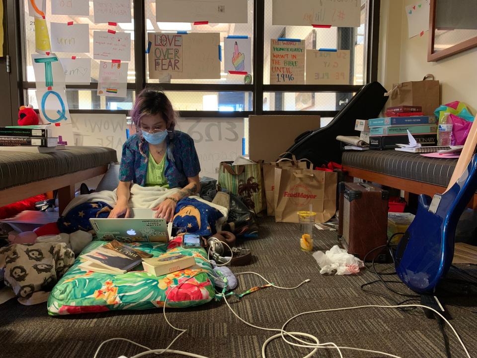 A student works during a sit-in of the president's office at Seattle Pacific University. The sit-in is currently in its fourth week and is aimed at reversing the university's policy to not hire employees who are gay.