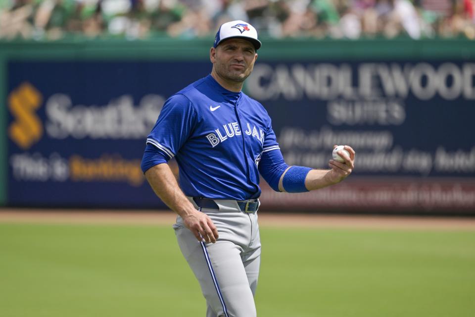 Toronto Blue Jays' Joey Votto warms up before a spring training baseball game against the Philadelphia Phillies Sunday, March 17, 2024, in Clearwater, Fla. (Steve Nesius/The Canadian Press via AP)