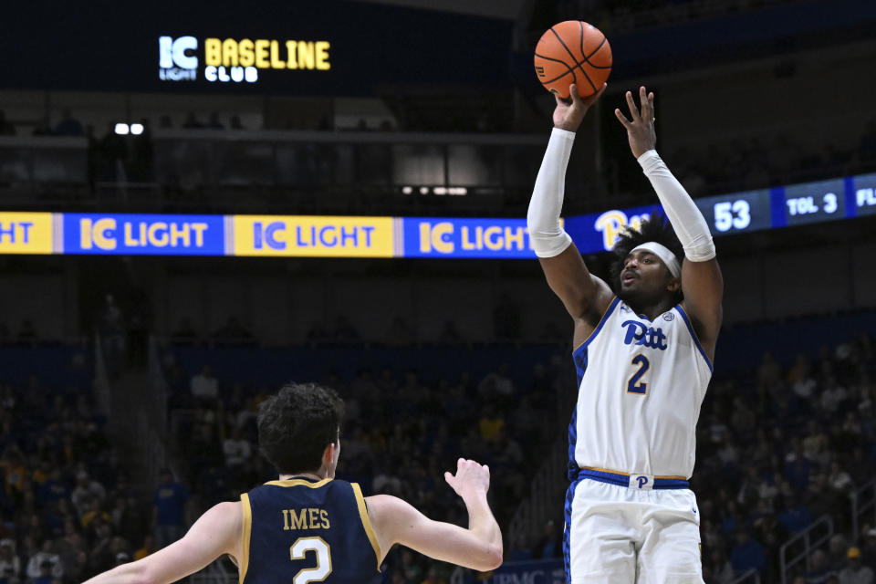 Pittsburgh forward Blake Hinson (2) shoots over Notre Dame guard Logan Imes (2) during the second half of an NCAA college basketball game, Saturday, Feb. 3, 2024, in Pittsburgh. (AP Photo/Barry Reeger)