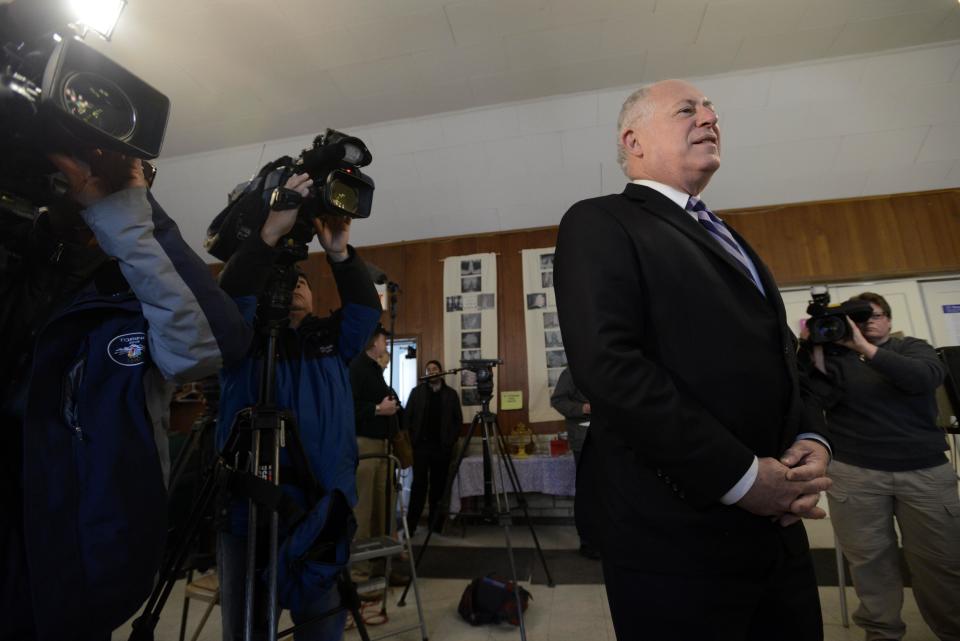 Illinois Gov. Pat Quinn waits in line before voting at Galewood Community Church in Chicago, Tuesday, March 18, 2014. (AP Photo/Paul Beaty)