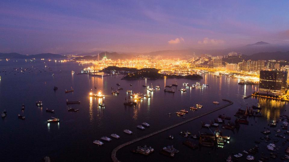 nighttime view of Hong Kong's Tsing Yi district and Tsing Ma Bridge with Stonecutters Island in foreground