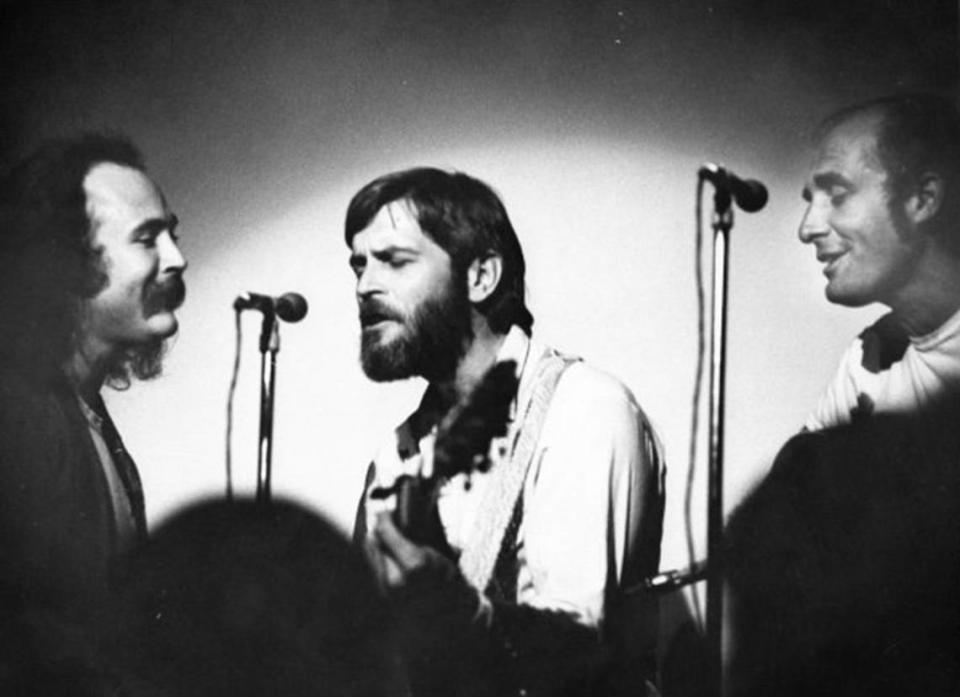 In this file photo from 1971, David Crosby, left, Bobby Ingram and Vince Martin play at the Flick coffeehouse in Coral Gables on Ponce de Leon Boulevard. Ingram and Martin returned to play a 50th anniversary festival at the same building, now Titanic Restaurant & Brewery in 2014.