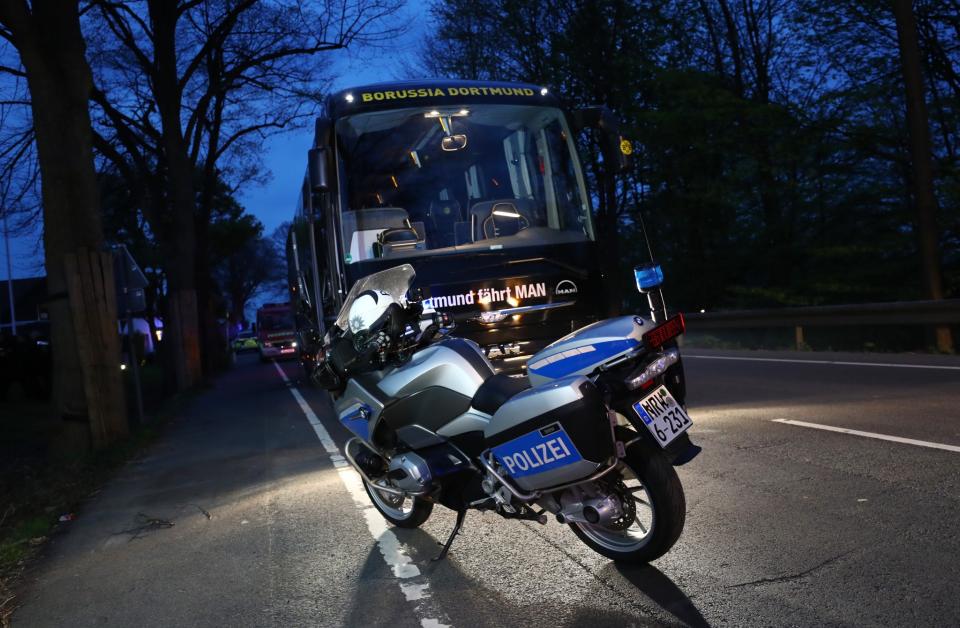 <p>A Police motorcylce with the Borussia Dortmund team bus after an explosion near their hotel before the game Reuters / Kai Pfaffenbach Livepic </p>