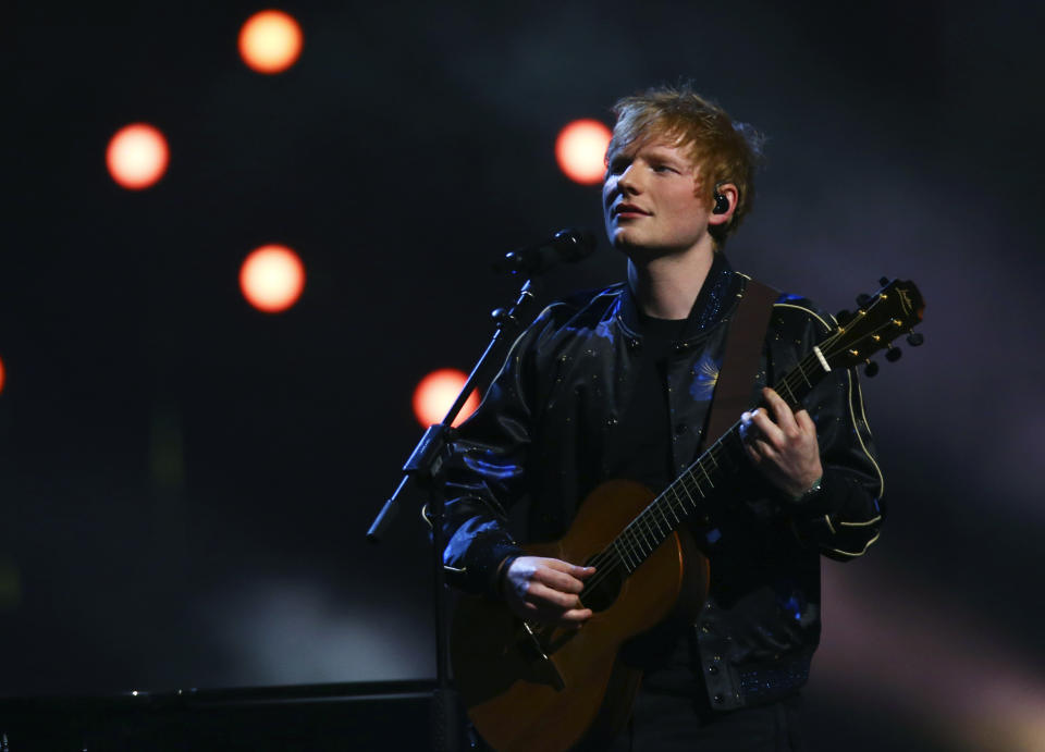 FILE - Ed Sheeran performs on stage at the Brit Awards 2022 in London Tuesday, Feb. 8, 2022. Sunday’s Billboard Music Awards on May 15 will include performances by Sheeran, Travis Scott, Becky G and other artists who have enjoyed chart-topping success. Sean “Diddy” Combs will emcee the show, which is being broadcast live from the MGM Grand Arena and will air live on NBC and its Peacock streaming service. (Photo by Joel C Ryan/Invision/AP, File)