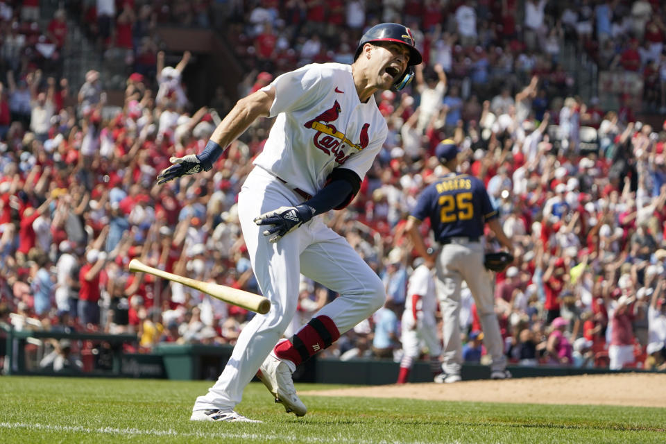 St. Louis Cardinals' Dylan Carlson, left, celebrates after after hitting a solo home run off Milwaukee Brewers relief pitcher Taylor Rogers (25) during the eighth inning of a baseball game Sunday, Aug. 14, 2022, in St. Louis. (AP Photo/Jeff Roberson)