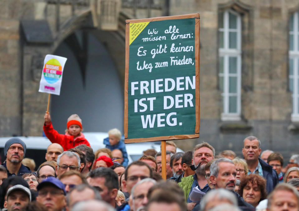 <p>People hold a banner reading: “Peace is the way” as they attend a manifestation following the killing of a German man in Chemnitz, Germany, Sept. 2, 2018. (Photo: Hannibal Hanschke/Reuters) </p>