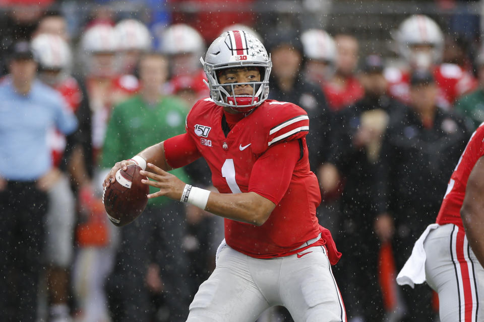 Ohio State quarterback Justin Fields drops back to pass against Wisconsin during the first half of an NCAA college football game Saturday, Oct. 26, 2019, in Columbus, Ohio. (AP Photo/Jay LaPrete)