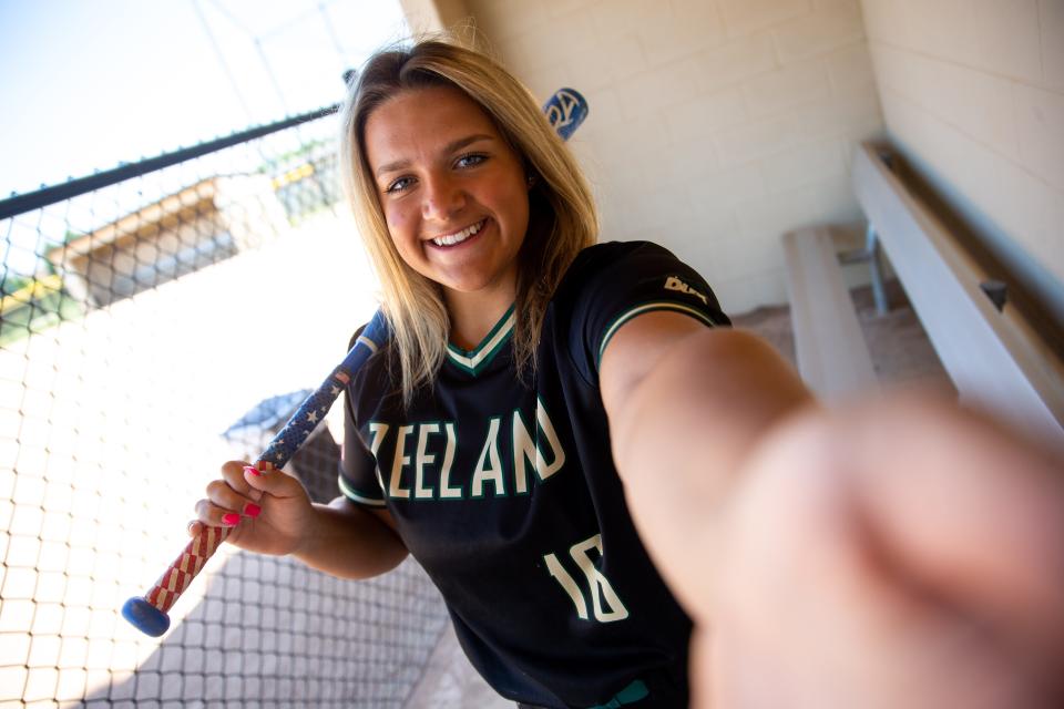 Zeeland West's Carly Sleeman poses for a photo in the Dux dugout Tuesday, June 28, 2022, at Zeeland West's softball field. Sleeman has been named The Sentinel's co-softball player of the year alongside Hamilton's Madie Jamrog. 