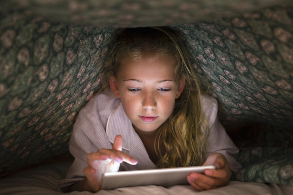 Parents are paying their children to stay off their tablets [Photo: Getty]