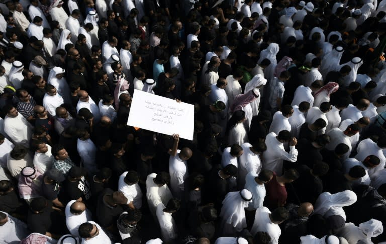 Saudi Shiites take part in a mass funeral on May 25, 2015, for the victims of a mosque bombing carried out by the Islamic State group, the sort of attack that Human Right Watch says is being fanned by hate speech against the minority community