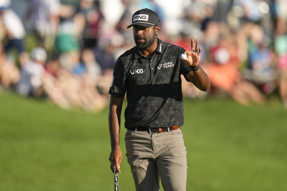 Sahith Theegala waves after making a putt on the 18th hole during the third round of the PGA Championship golf tournament at the Valhalla Golf Club, Saturday, May 18, 2024, in Louisville, Ky. (AP Photo/Sue Ogrocki)