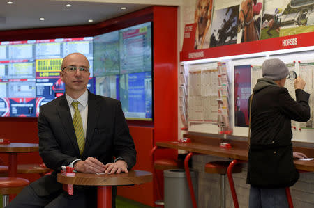 Alistair Meeks poses for a portrait at a branch of Ladbrokes in central London, Britain, May 17, 2016. REUTERS/Toby Melville