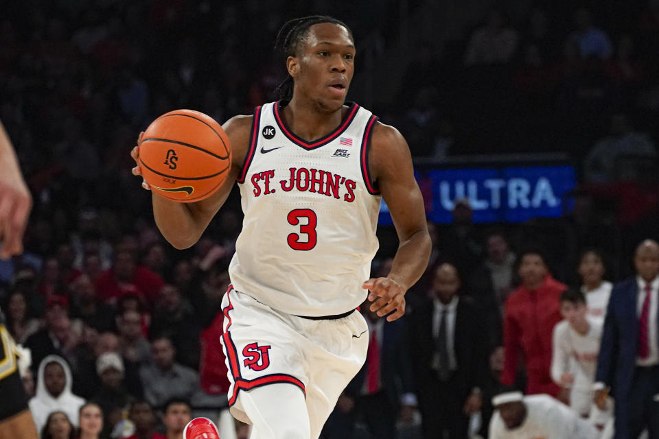 St. John's Jordan Dingle looks to pass during the first half of an NCAA college basketball game against Michigan in New York, Monday, Nov. 13, 2023. (AP Photo/Peter K. Afriyie)