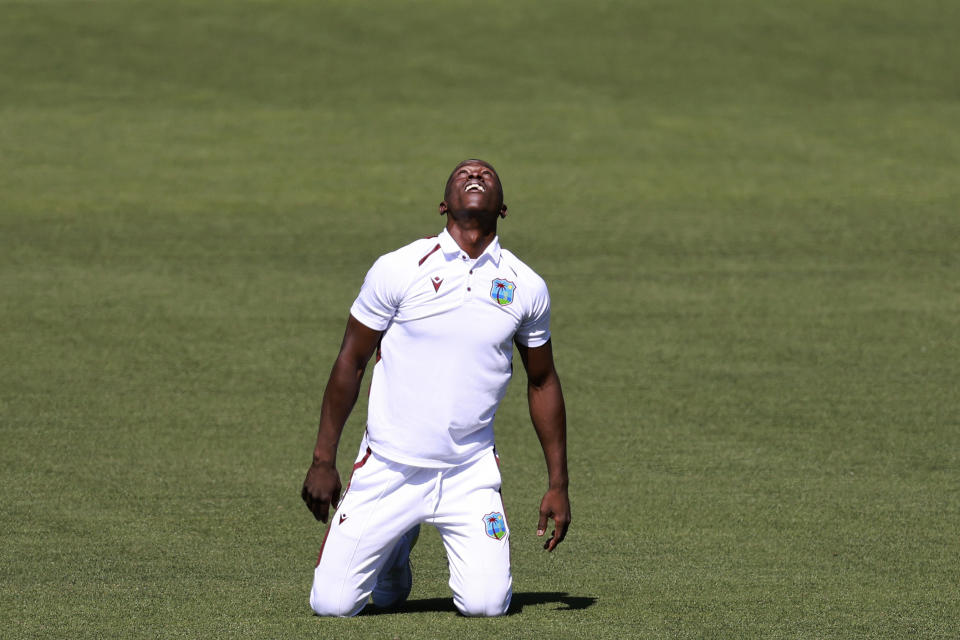 West Indies' Shamar Joseph celebrates after taking the wicket of Australia's Steve Smith on the first day of their cricket test match in Adelaide, Australia, Wednesday, Jan. 17, 2024. (AP Photo/James Elsby)