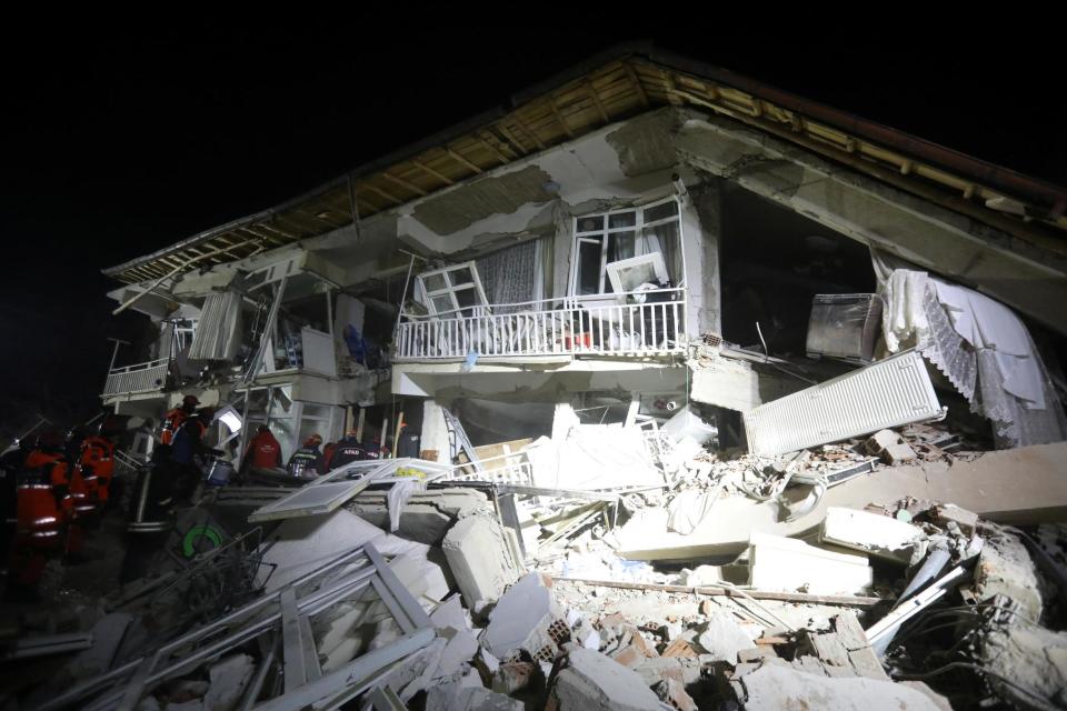 Wreckage: Buildings were decimated in the quake (REUTERS)