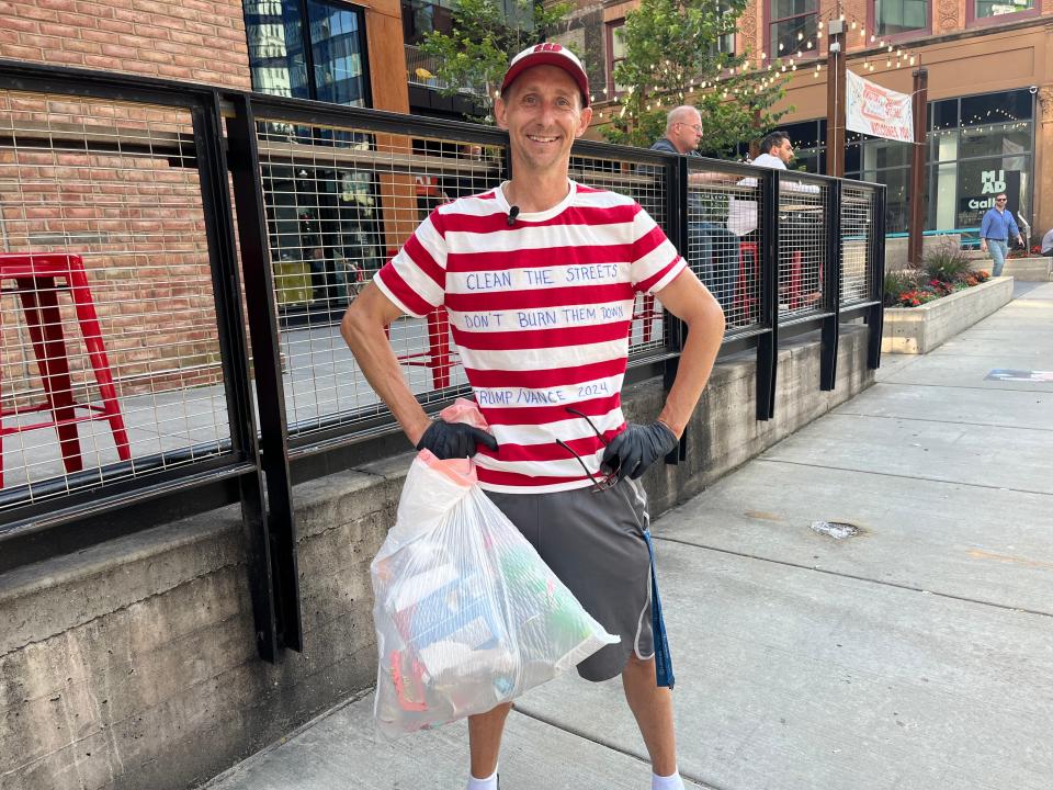 James Taylor of Milwaukee was raising awareness for fathers' rights while picking up a lot of trash in downtown Milwaukee on Tuesday, July 16, 2024.