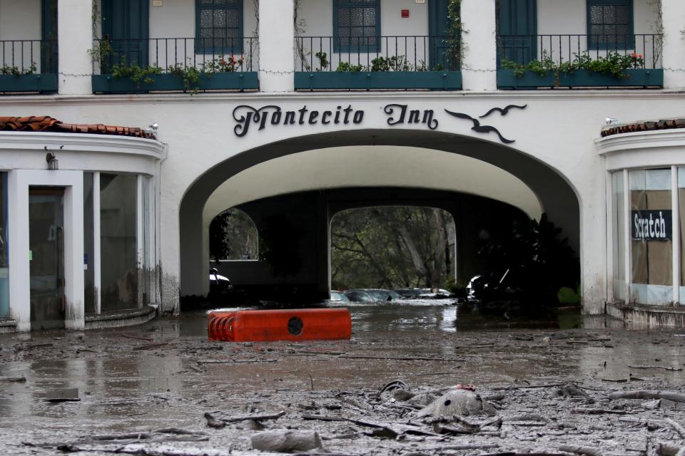 Debris and mud cover the entrance of the Montecito Inn after heavy rain brought flash flooding and mudslides to the area in Montecito, Calif. on Tuesday, Jan. 9, 2018.