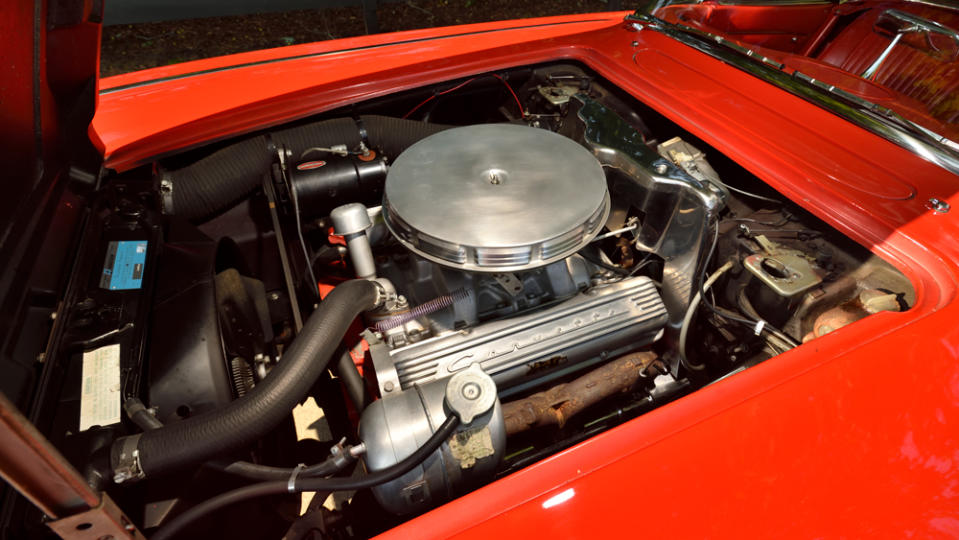 The 340 hp, Chevy 327 ci V-8 under the hood of a 1962 Chevrolet Corvette Convertible.