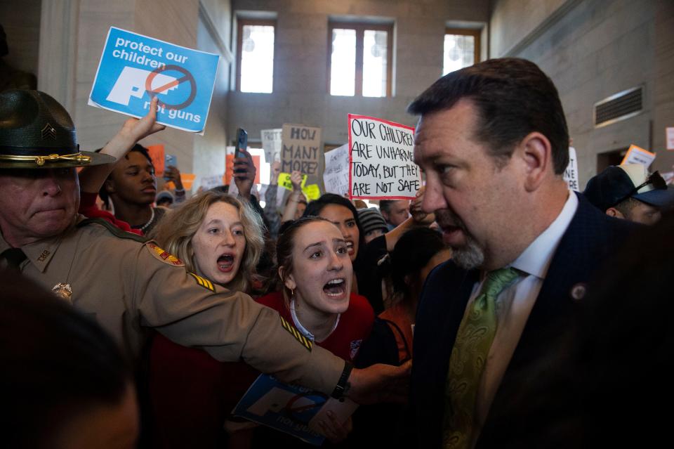 Addie Brue, 16 and Madeline Lederman, 17, cries out “Do something,” with other protesters as Rep. Jeremy Faison, R-Cosby, Chairman of the House Republican Caucus, walks towards the House chamber doors during at the State Capitol Building in Nashville , Tenn., Wednesday, March 29, 2023.