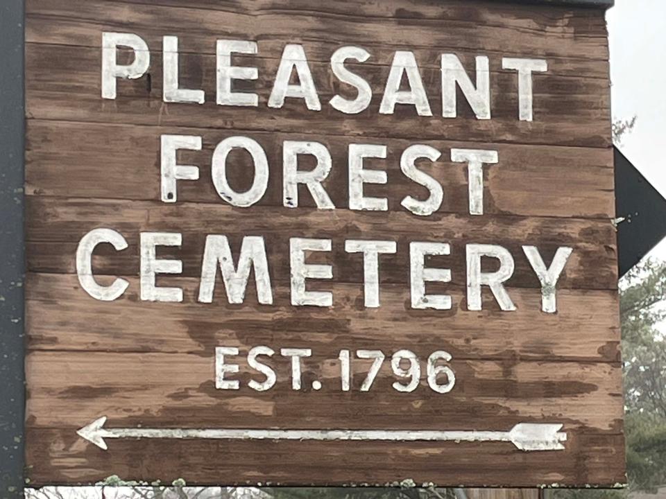 Pleasant Forest Cemetery retains its rustic charm with a well-maintained wooden entrance sign. Jan. 18, 2023.