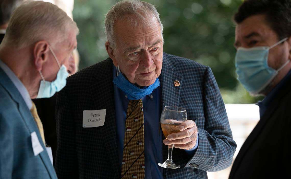 Frank Daniels Jr. talks with Frank Daniels III during a reception after the Daniels family announced the Frank A. Daniels, Jr. Executive In Residence program at the UNC Hussman School of Journalism during a ceremony on Tuesday, September 22, 2020 in Raleigh, N.C.