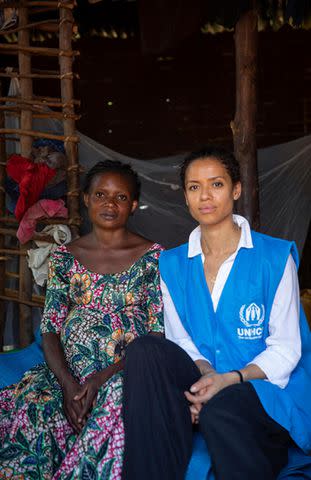 <p>UNHCR/Caroline Irby</p> UNHCR Goodwill Ambassador Gugu Mbatha-Raw with Cadette, 25, pregnant with her seventh child, in her home in a resettlement site in Kalehe.