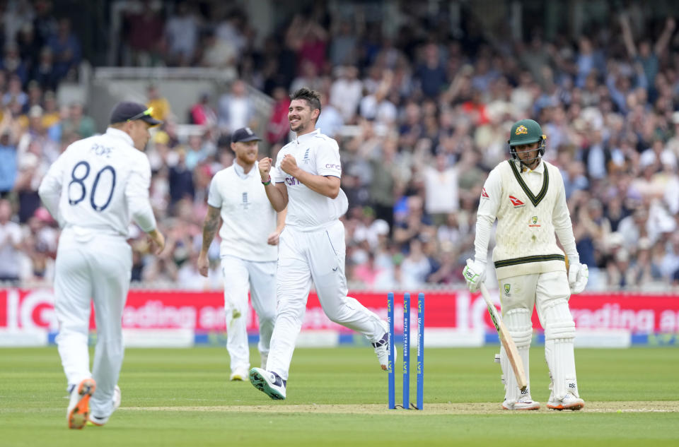 England's Josh Tongue celebrates taking the wicket of Australia's Usman Khawaja, right, during day one of the second Ashes Test cricket match at Lord's Cricket Ground, London, England, Wednesday, June 28, 2023. (AP Photo/Kirsty Wigglesworth)