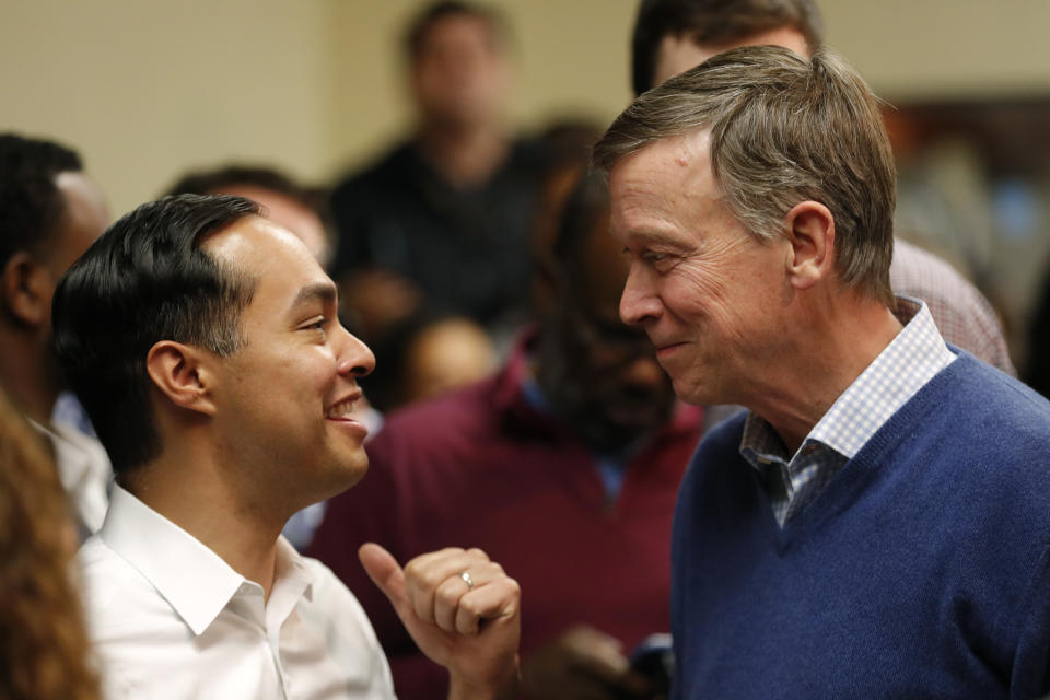 Former Colorado Gov. John Hickenlooper, right, talks with former Housing and Urban Development Secretary and Democratic presidential candidate Julian Castro at the Story County Democrats' annual soup supper fundraiser, Saturday, Feb. 23, 2019, in Ames, Iowa. (AP Photo/Charlie Neibergall)