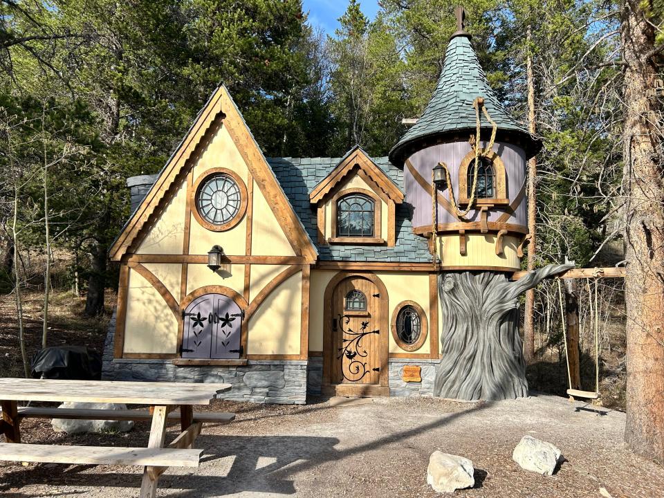 Rapunzel's Cottage with swing and turrets at Charmed Resorts