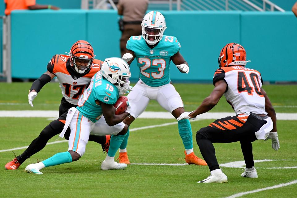 Dec 6, 2020; Miami Gardens, Florida, USA; Cincinnati Bengals wide receiver Stanley Morgan (17) tackles Miami Dolphins wide receiver Jakeem Grant (19) on the punt return during the first half at Hard Rock Stadium.