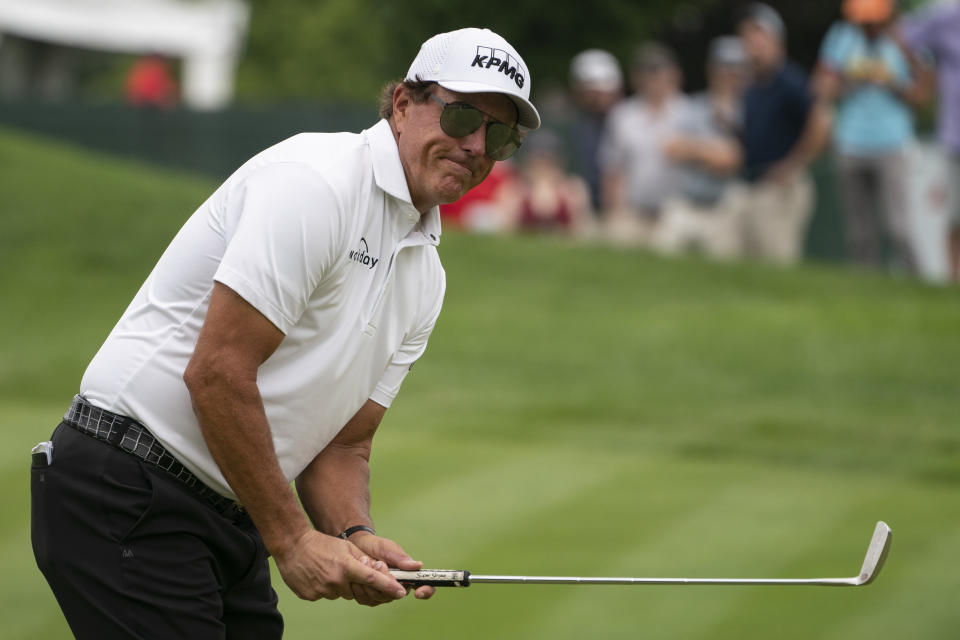 Phil Mickelson reacts after missing a putt on the ninth green during the final round of the Travelers Championship golf tournament at TPC River Highlands, Sunday, June 27, 2021, in Cromwell, Conn. (AP Photo/John Minchillo)
