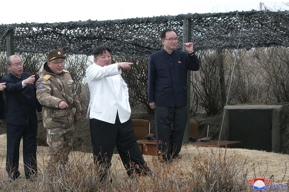 In this photo provided by the North Korean government, North Korean leader Kim Jong Un, second right, supervises what it says a test launch of a Hwasal strategic cruise missile during an exercise in North Korea Wednesday, March 22, 2023. Independent journalists were not given access to cover the event depicted in this image distributed by the North Korean government. The content of this image is as provided and cannot be independently verified. Korean language watermark on image as provided by source reads: "KCNA" which is the abbreviation for Korean Central News Agency. (Korean Central News Agency/Korea News Service via AP)