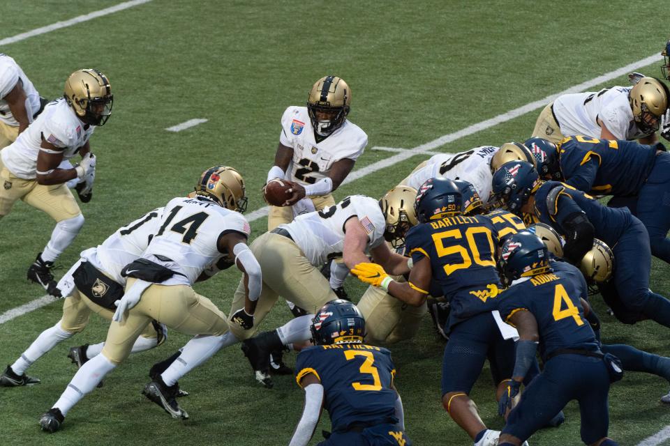 Army quarterback Tyhier Tyler (2) prepares for a handoff during the first half against West Virginia at the 2020 Liberty Bowl. JUSTIN FORD/USA TODAY Sports