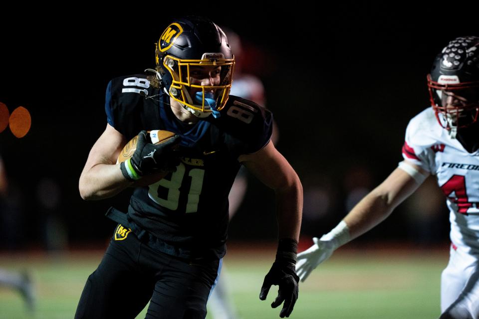 Moeller tight end Eli Jacon-Duffy (81) scores a touchdown in the OHSAA playoff regional final football game at Princeton High School Friday.