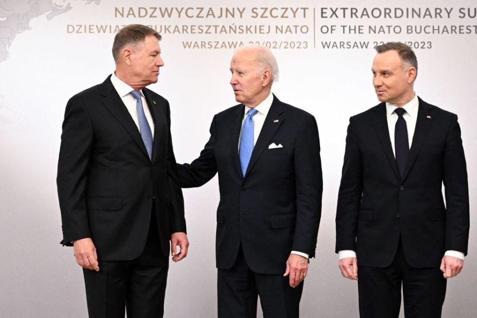 President Biden poses during a group photo with the Polish President Andrzej Duda and Romanian President Klaus Iohannis at the Presidential Palace in Warsaw on Feb. 22, 2023. / Credit: MANDEL NGAN/AFP via Getty Images