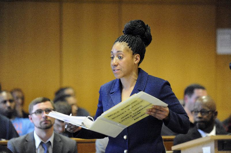 Wayne County Assistant Prosecuting Attorney Lisa Lindsey speaks before Judge Thomas Jackson at Frank Murphy Hall of Justice, Monday, April 21, 2014, in Detroit. The four men who were accused of punching and kicking motorist, Steve Utash, who accidentally struck a 10-year-old Detroit boy, were ordered Monday to stand trial on attempted murder charges. (AP Photo/Detroit News, David Coates) DETROIT FREE PRESS OUT; HUFFINGTON POST OUT