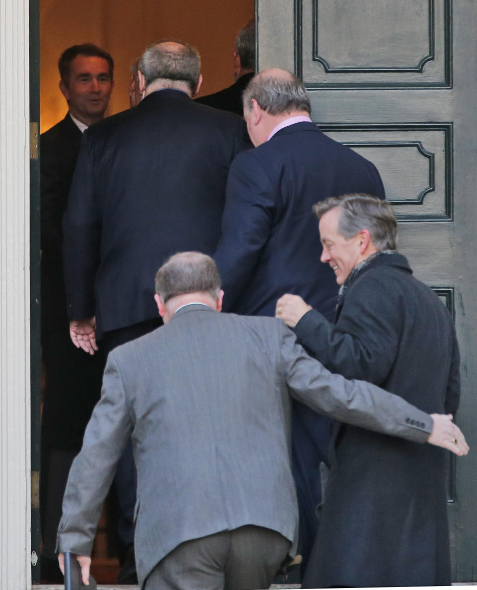 Virginia Gov. Ralph Northam, top left, welcome's House budget conferees as they arrive for a breakfast meeting at the Governor's mansion at the Capitol in Richmond, Va., Thursday, Feb. 14, 2019. (AP Photo/Steve Helber)