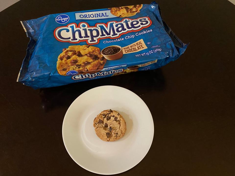 kroger chocolate chip cookies on a counter with cookie on plate in front