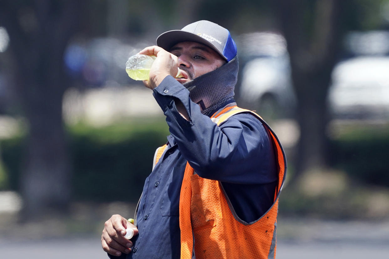 A worker during a parking lot resurfacing job in Richardson, Texas