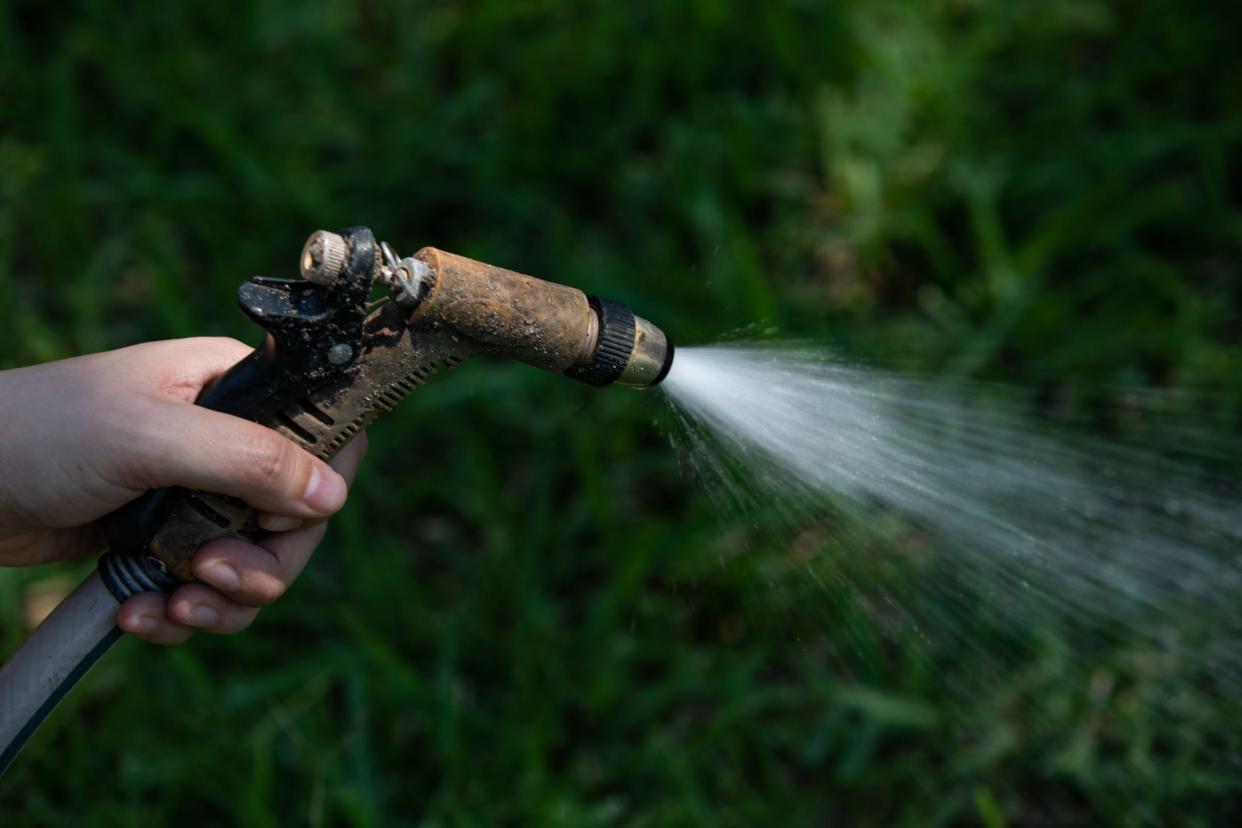 Watering using hand-held hoses will still be allowed after the cities of Georgetown and Leander on Friday ordered residents and business to immediately stop using irrigation systems and sprinklers to conserve water.