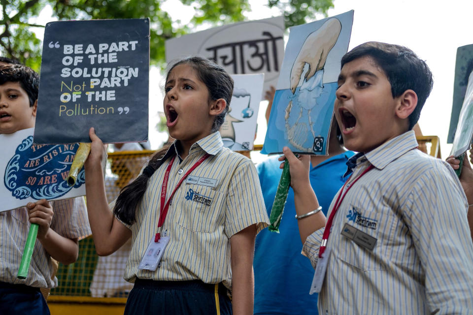 School children shout slogans as they participate in a climate strike to protest against governmental inaction towards climate breakdown and environmental pollution, part of demonstrations being held worldwide in a movement dubbed 