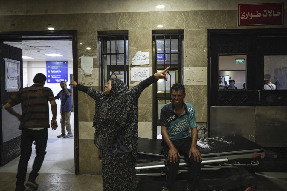 Palestinians react after their relative was killed in Israeli bombardment of the Gaza Strip at a hospital in Khan Younis, Thursday, June. 27, 2024. (AP Photo/Jehad Alshrafi)