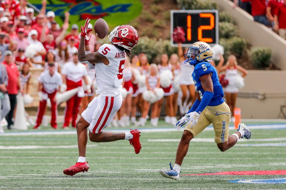 Sep 16, 2023; Tulsa, Oklahoma, USA; Oklahoma's Andrel Anthony (5) receives for a first down in the first quarter during an NCAA football game between University of Oklahoma (OU) and University of Tulsa at Skelly Field at H.A. Chapman Stadium. Mandatory Credit: Nathan J. Fish-USA TODAY Sports