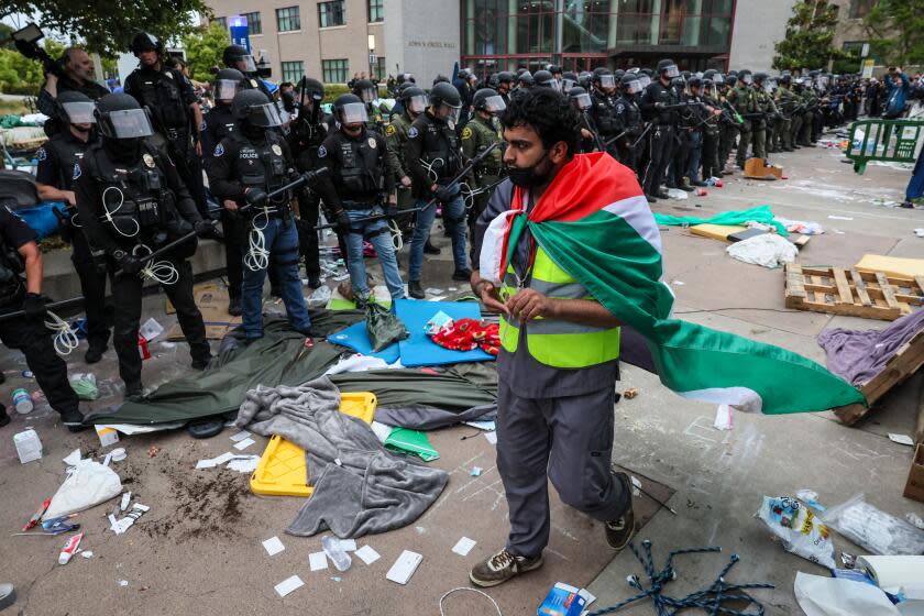 Irvine, CA, Wednesday, May 15, 2024 - Scores of law enforcement personnel from various agencies move hundreds of demonstrating students, faculty and supporters protesting the treatment of Palestinians and the UC system's investments in Isreali interests. (Robert Gauthier/Los Angeles Times)