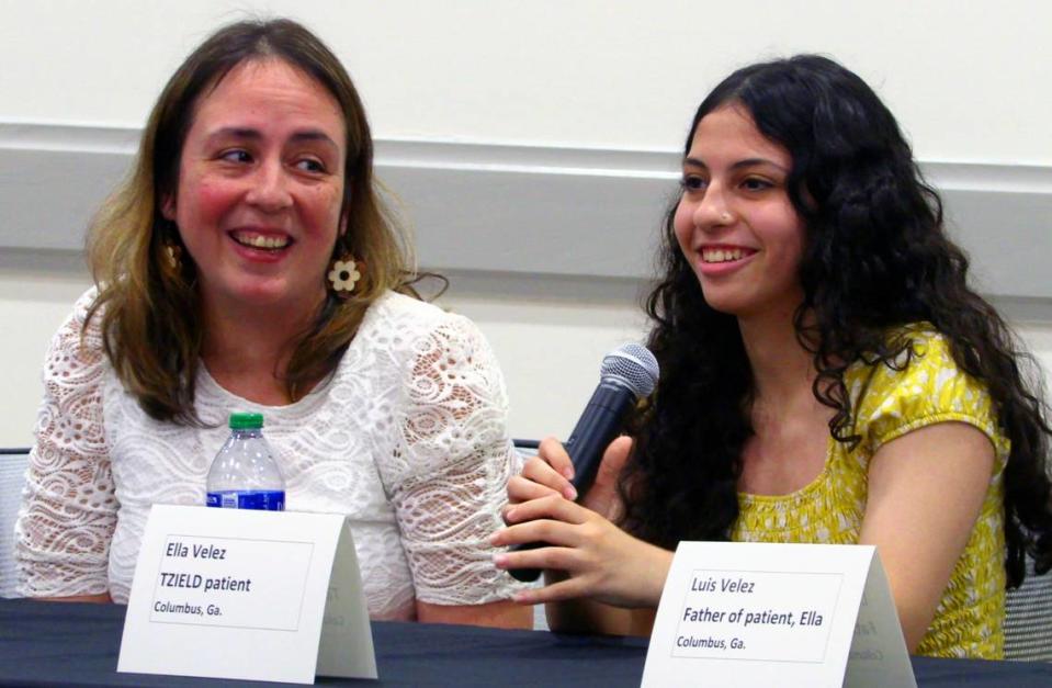 Ella Velez,right, a TZIELD patient from Columbus, Georgia, speaks during a Thursday afternoon press conference as her mother Lorna Velez listens. 05/23/2024