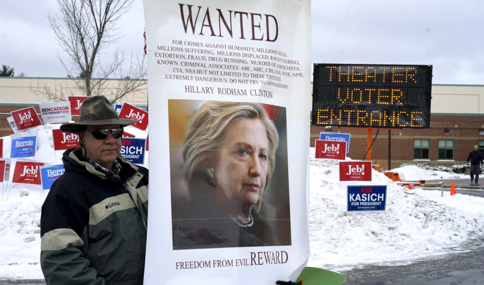 A protester outside a polling place in Bedford