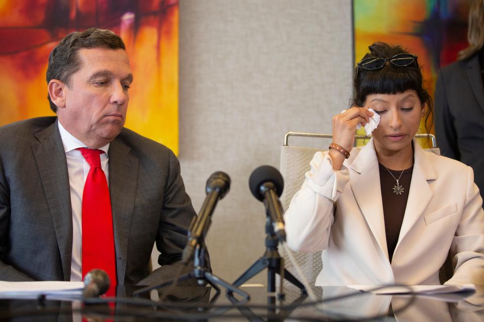 Ashley Solis, first woman to file sexual assault claims against Houston Texans quarterback Deshaun Watson, wipes away tears while giving her statement during a news conference Tuesday, April 6, 2021, in Houston.  (Yi-Chin Lee/Houston Chronicle via AP)