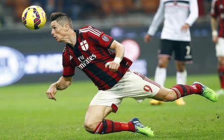 AC Milan's Fernando Torres heads the ball during their Serie A soccer match against Palermo at San Siro stadium in Milan, November 2, 2014. REUTERS/Stefano Rellandini